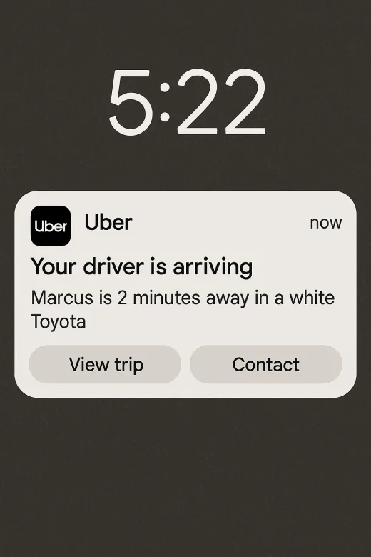 An Android lock screen showing an Uber push notification that the driver is arriving, with View trip and Contact buttons.